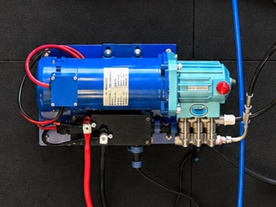 LEDI Modular CAT pump module: CAT plunger pump and motor on a blue mounting plate