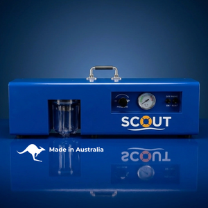 Blue device with 'SCOUT' branding on a reflective surface against a dark background